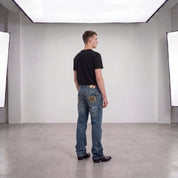 Washed detailed Bootcut jeans W33/L32 – am Model, hinten, mit Boots